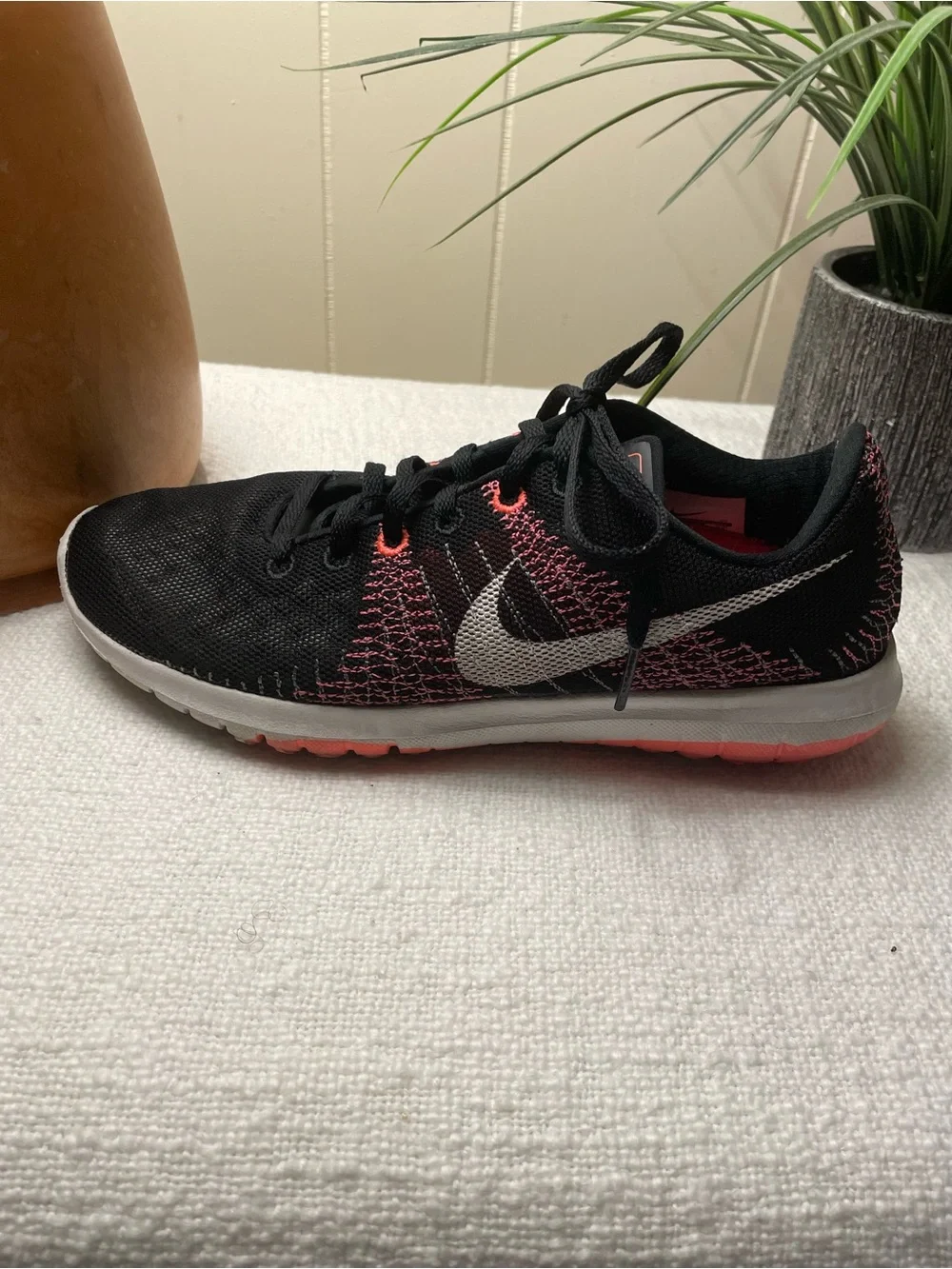 Nike Women’s Black and Coral Knit Running Shoe